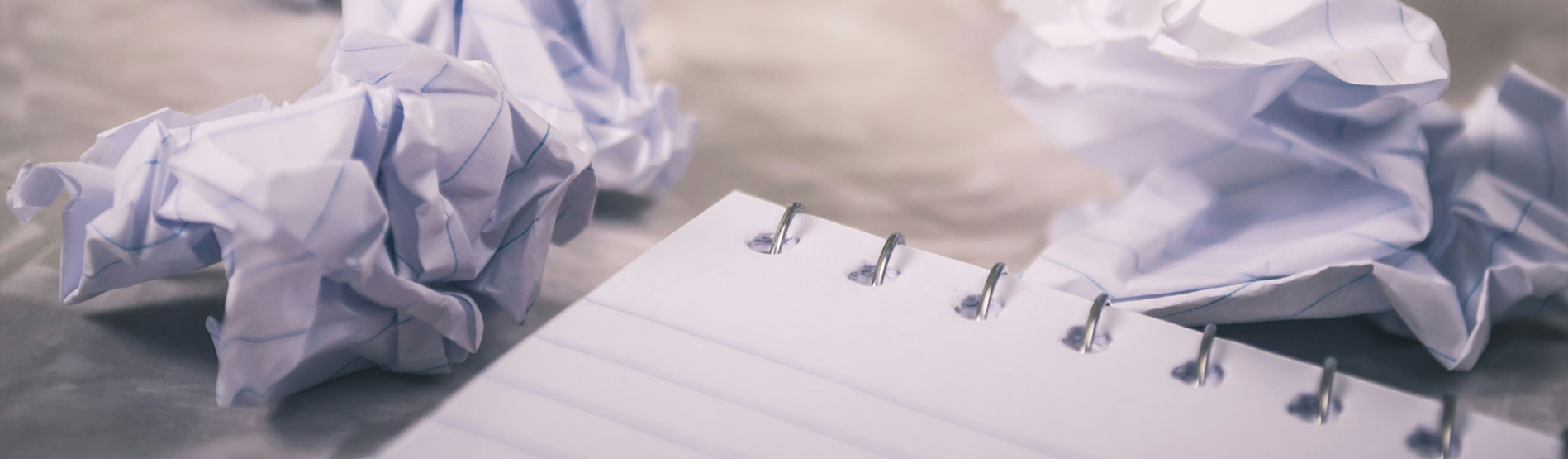 Screwed up pieces of paper.