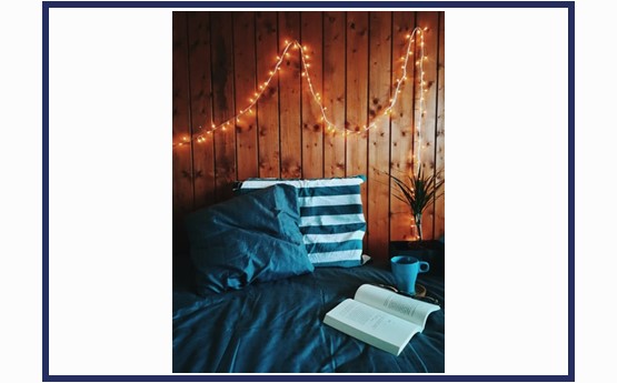 Fairy lights above a bed