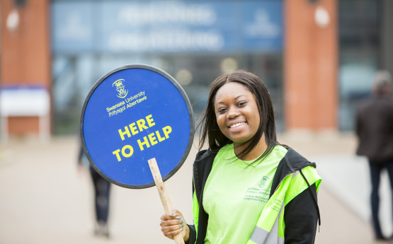 Girl holding here to help sign