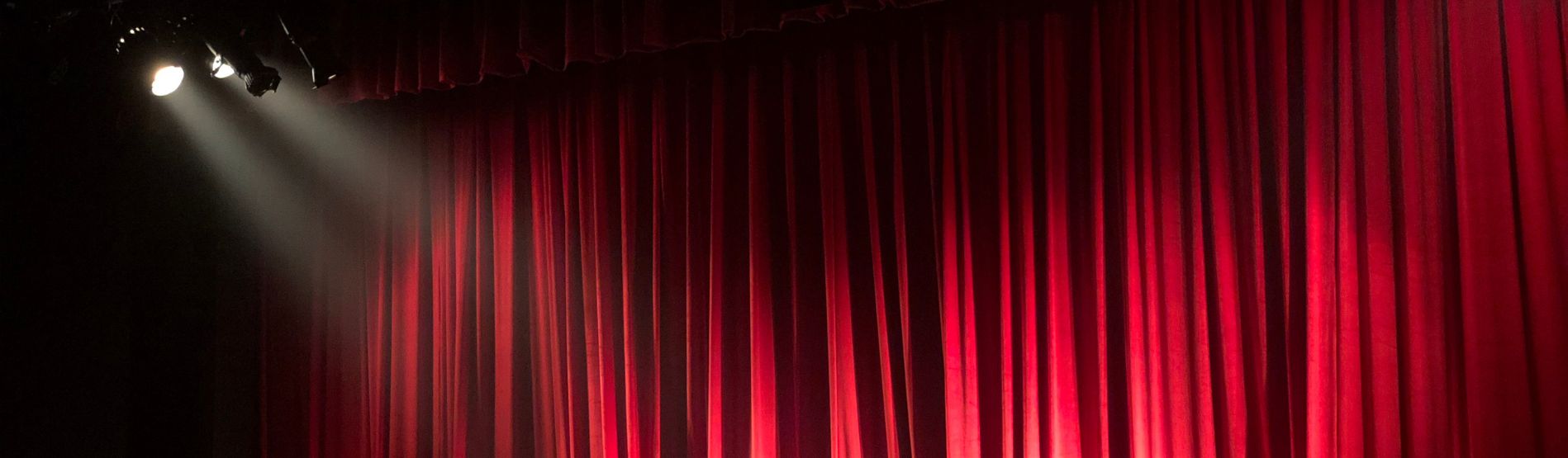 Image of a theatre curtain with lights