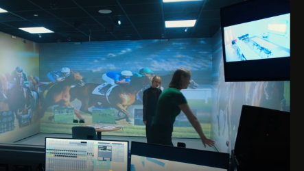 Immersive suite with horse racing on screens 