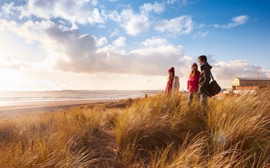 students overlooking swansea bay campus beach