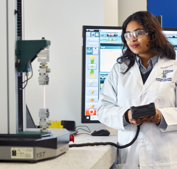 Biomedical student conducting a tensile test