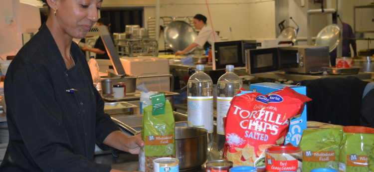 Women sorting through food items