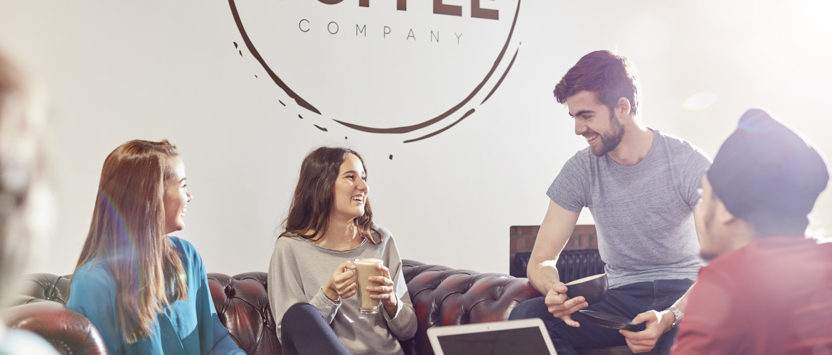 Three students having coffee in Fulton Coffee