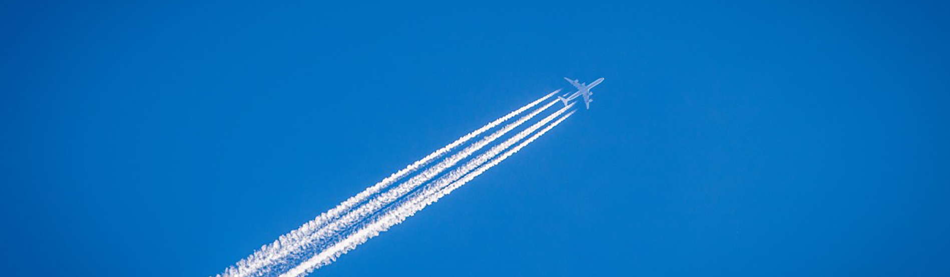 Photo of plane emitting contrails