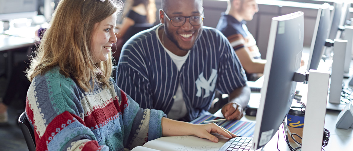 students sat at a computer