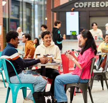 students sitting around a table chatting