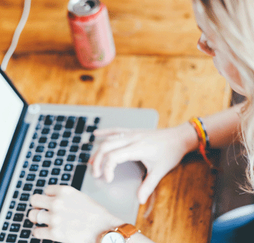 Girl sat at laptop