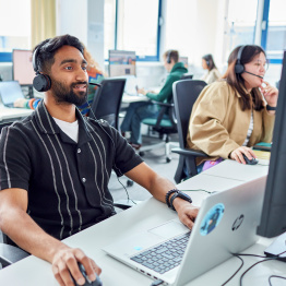 A image of two Clearing team phone line operators working.