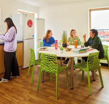 An image of a group of students in a shared kitchen in student accommodation.