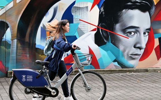 Student with bike. 