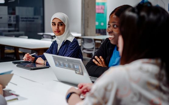 Students on a laptop. 
