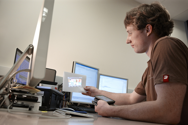 Student projecting computer onto paper