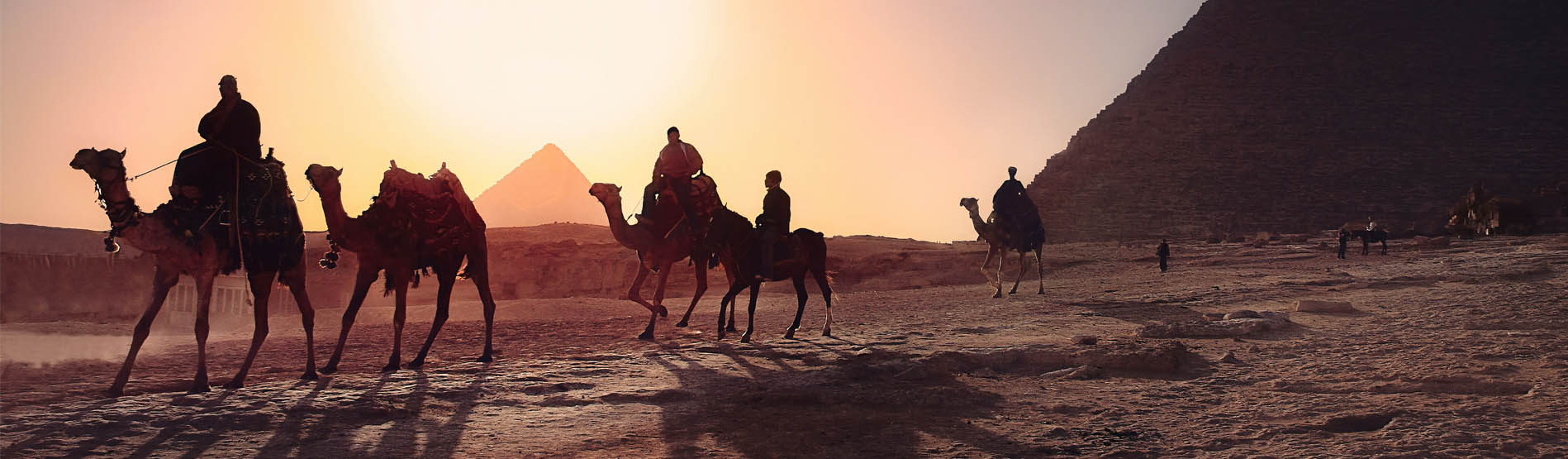 image of Egypt pyramids and people on the camels