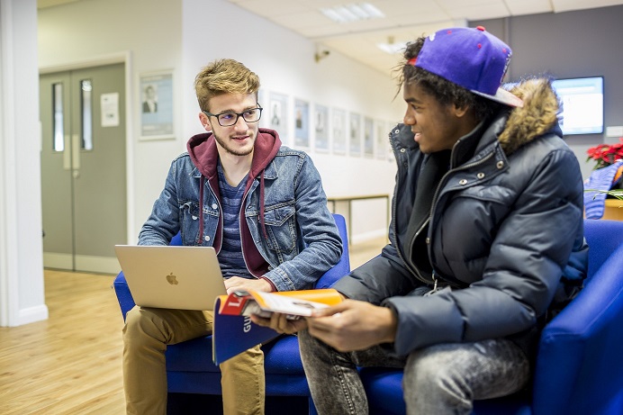 Two students sitting and talking