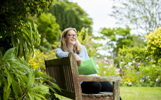 Student on bench in Singleton Park