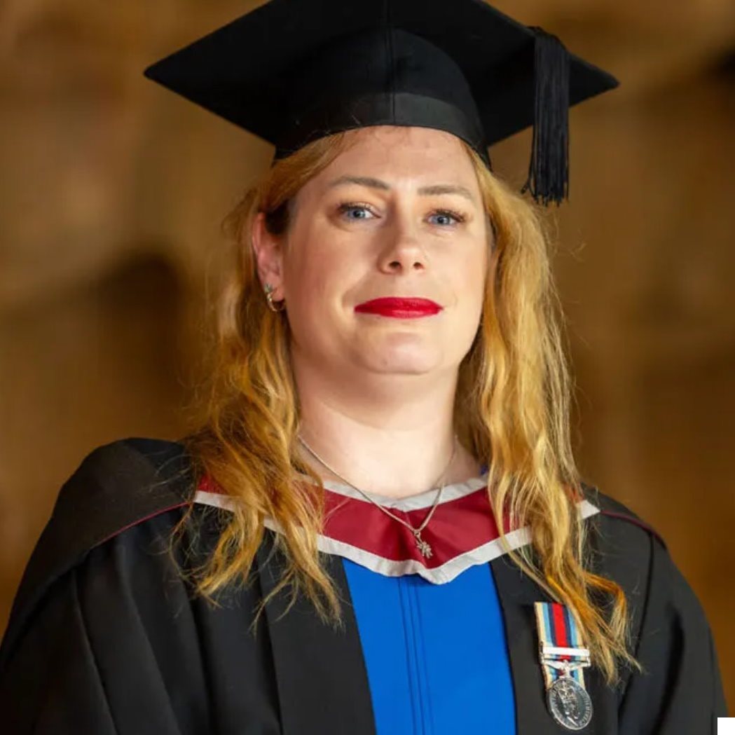 Carrie in graduation cap and gown