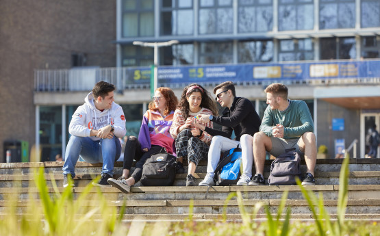 Students sitting outside Fulton House