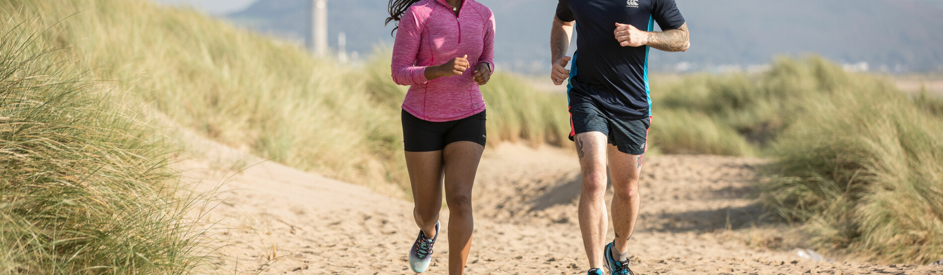 students running on beach 