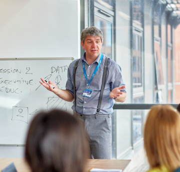 Lecturer talking to students
