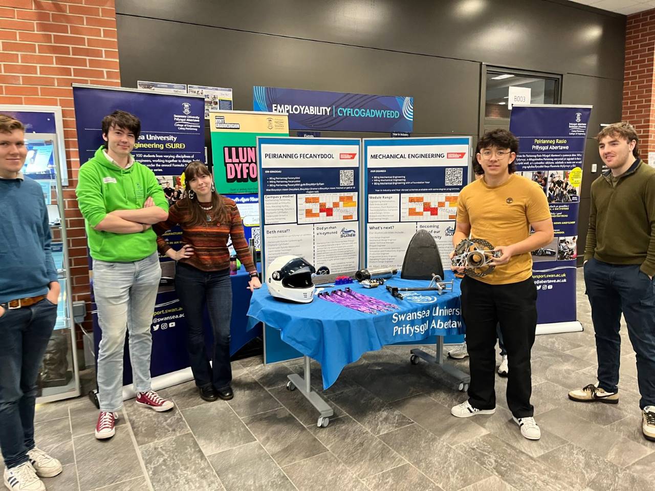 Students at open day stand.