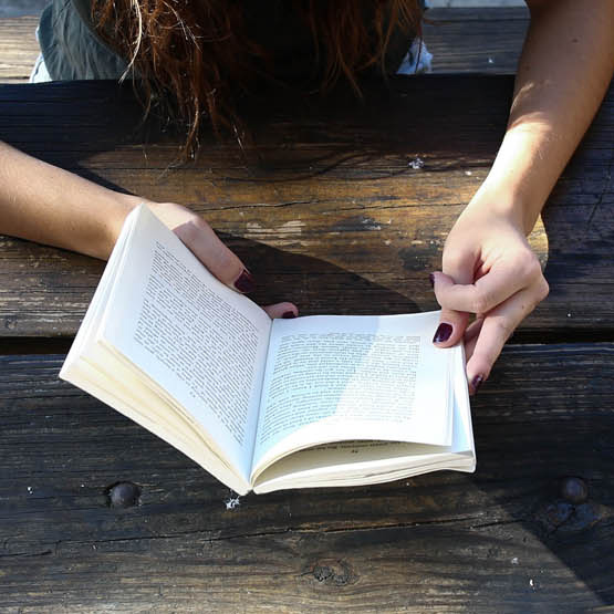 Image of a person reading a book 