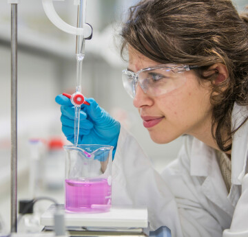 Student using chemistry equipment