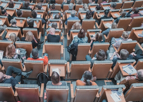 A lecture room with people