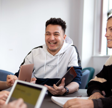 Student laughing on seat 