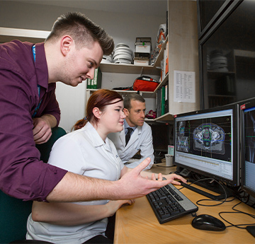 Student examining a scan