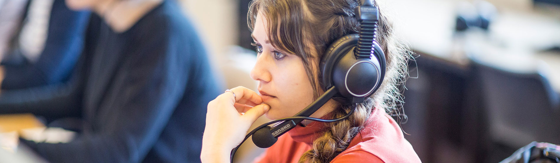 Language student studying with headphones 