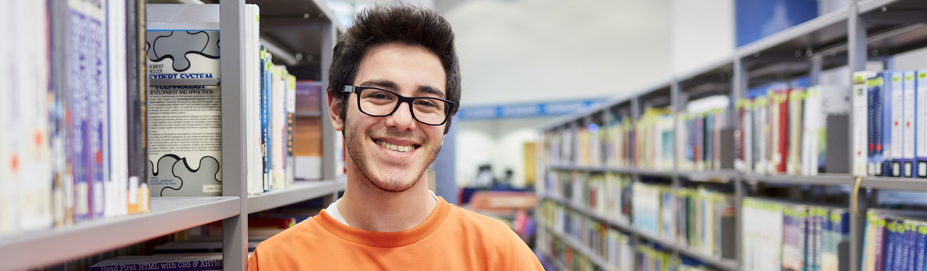 Student stood in library 