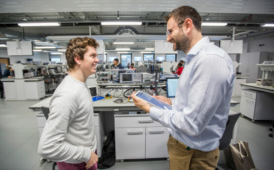 Lecturer and student having a conversation