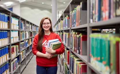 A student holding books