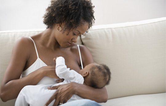 Image of a man, woman, a child and a baby