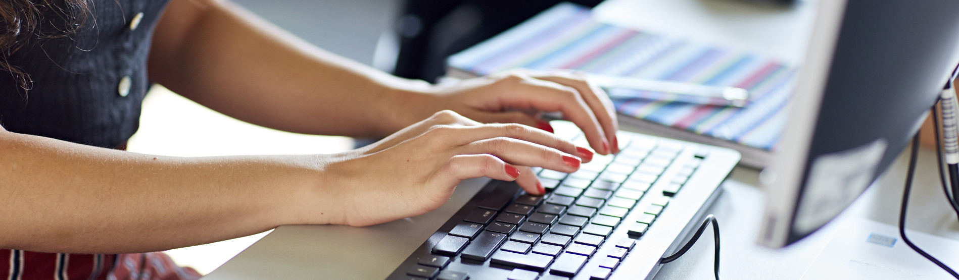 hands typing on a laptop