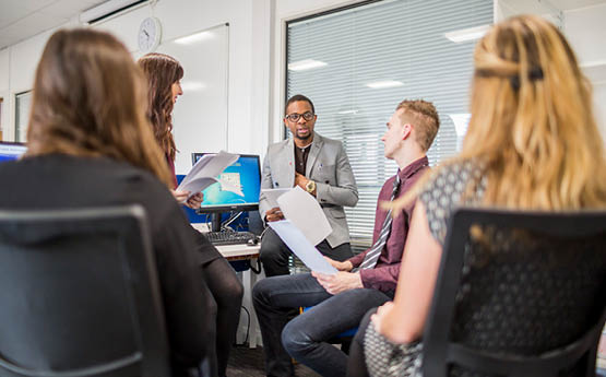 group of people in a meeting working together