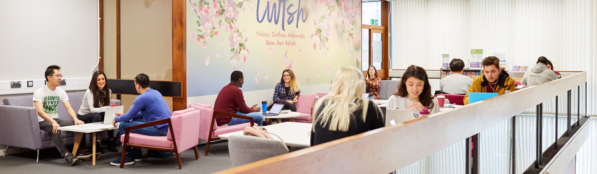 Students studying and relaxing in the library