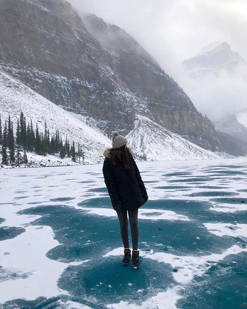 student standing on frozen lake