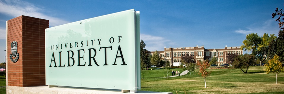 University sign and campus