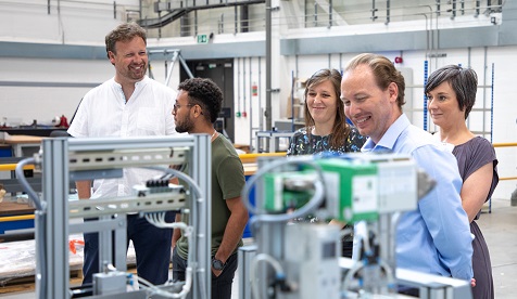 Researchers touring engineering facilities