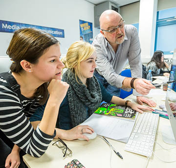 lecturer helping students