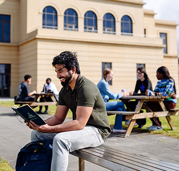 Students reading the International Guide