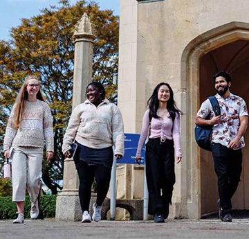 A group of international students walking on the campus