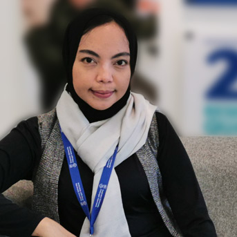 Female Indonesian students looking into the camera