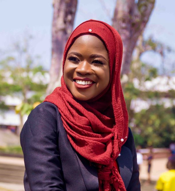 Photo of a Nigerian student outside in the sun.