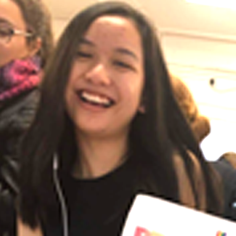 Smiling student from Thailand with long brown hair