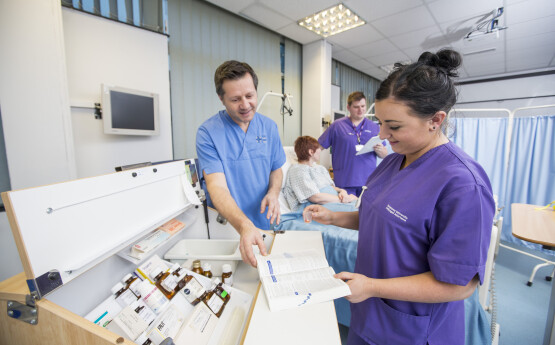 students and doctors looking at the apparatus 