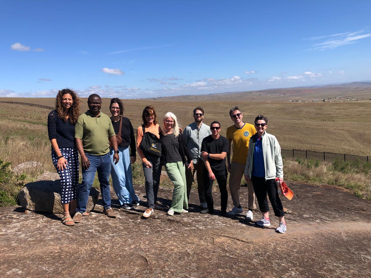 Social repair team members on a hillside
